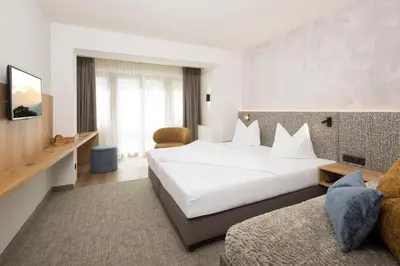 Ein Bett oder Betten in einem Zimmer der Unterkunft Hotel Stockerwirt