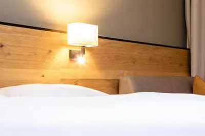 Ein Bett oder Betten in einem Zimmer der Unterkunft Hotel Stockerwirt