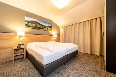 Ein Bett oder Betten in einem Zimmer der Unterkunft Hotel Stockerwirt