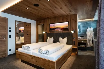 Ein Bett oder Betten in einem Zimmer der Unterkunft Hotel Huber Hochland
