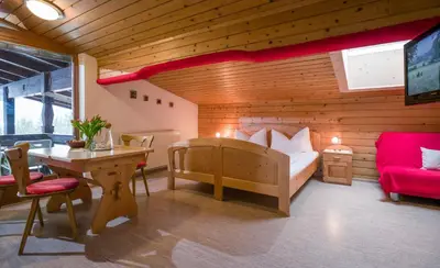 Ein Bett oder Betten in einem Zimmer der Unterkunft Appartements Rofangarten