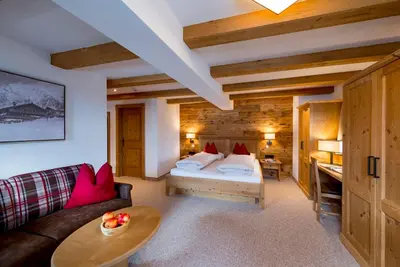 Ein Bett oder Betten in einem Zimmer der Unterkunft Alpengasthof Rossmoos