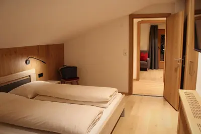 Ein Bett oder Betten in einem Zimmer der Unterkunft Alpengasthof Rossmoos