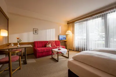 Ein Bett oder Betten in einem Zimmer der Unterkunft Aparthotel Andreas Hofer