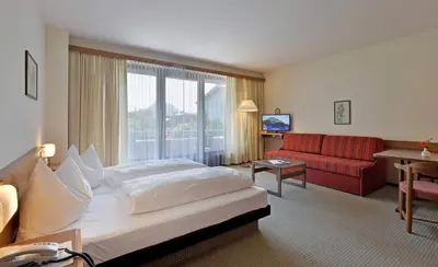 Ein Bett oder Betten in einem Zimmer der Unterkunft Aparthotel Andreas Hofer