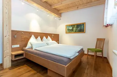 Ein Bett oder Betten in einem Zimmer der Unterkunft Brandstatthof Leogang