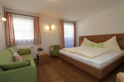 Ein Bett oder Betten in einem Zimmer der Unterkunft Brandstatthof Leogang