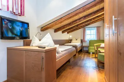 Ein Bett oder Betten in einem Zimmer der Unterkunft Brandstatthof Leogang