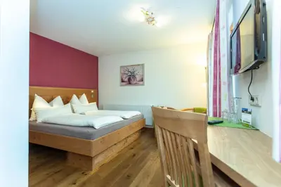 Ein Bett oder Betten in einem Zimmer der Unterkunft Brandstatthof Leogang