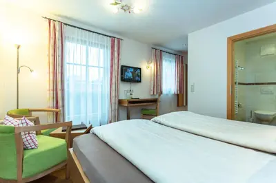 Ein Bett oder Betten in einem Zimmer der Unterkunft Brandstatthof Leogang