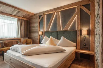 Ein Bett oder Betten in einem Zimmer der Unterkunft Kohlerhof - 4 Star Wellness & Active Hotel