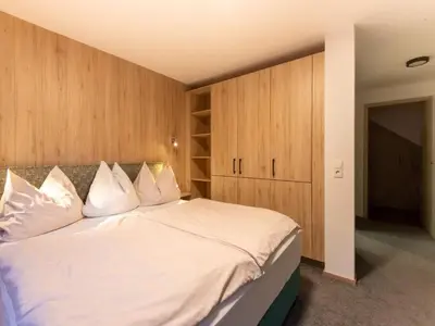 Ein Bett oder Betten in einem Zimmer der Unterkunft Lovely Apartment with Sauna, Ski Storage, Pool, Terrace