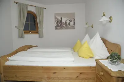 Ein Bett oder Betten in einem Zimmer der Unterkunft Ferienwohnungen Sunshine Stumm