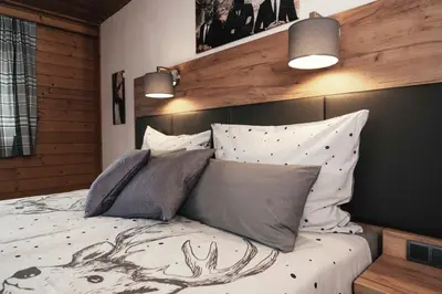 Ein Bett oder Betten in einem Zimmer der Unterkunft Golf & Ski Chalet