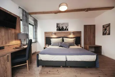 Ein Bett oder Betten in einem Zimmer der Unterkunft Golf & Ski Chalet