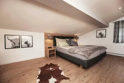 Ein Bett oder Betten in einem Zimmer der Unterkunft Golf & Ski Chalet