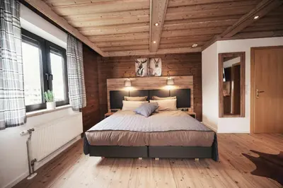 Ein Bett oder Betten in einem Zimmer der Unterkunft Golf & Ski Chalet