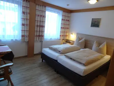 Ein Bett oder Betten in einem Zimmer der Unterkunft Hotel Peter