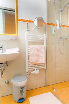 Ein Badezimmer in der Unterkunft Hotel Schneeberger