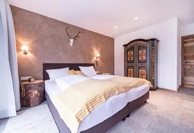 Ein Bett oder Betten in einem Zimmer der Unterkunft VIERKLEE - Das kinderfreundliche Ferienhaus am Achensee