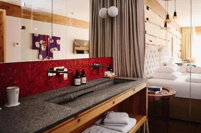 Ein Bett oder Betten in einem Zimmer der Unterkunft Small Luxury Hotel of the World - DasPosthotel