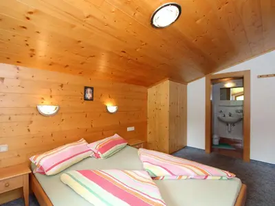 Ein Bett oder Betten in einem Zimmer der Unterkunft Apartment Alpin by Interhome