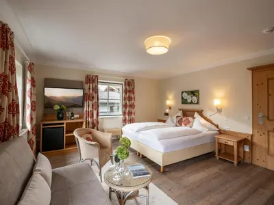 Ein Bett oder Betten in einem Zimmer der Unterkunft Alpen Glück Hotel Villa Lisa garni