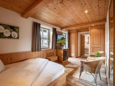 Ein Bett oder Betten in einem Zimmer der Unterkunft Alpen Glück Hotel Villa Lisa garni