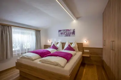 Ein Bett oder Betten in einem Zimmer der Unterkunft Ferienwohnungen Obinghof
