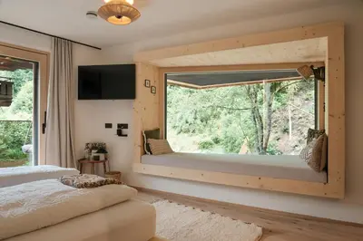 Ein Bett oder Betten in einem Zimmer der Unterkunft Grand Pension Franziska - inkl CrossFit Gym