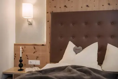Ein Bett oder Betten in einem Zimmer der Unterkunft Appartements Alpenkristall