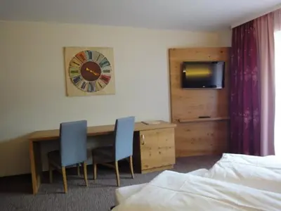 Ein Bett oder Betten in einem Zimmer der Unterkunft Hotel Alpenblick