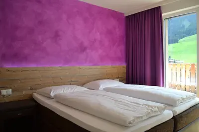 Ein Bett oder Betten in einem Zimmer der Unterkunft Hotel Alpenblick