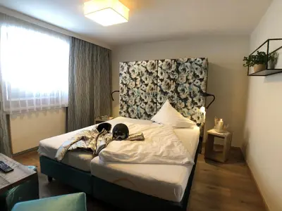 Ein Bett oder Betten in einem Zimmer der Unterkunft Hotel Alpenblick
