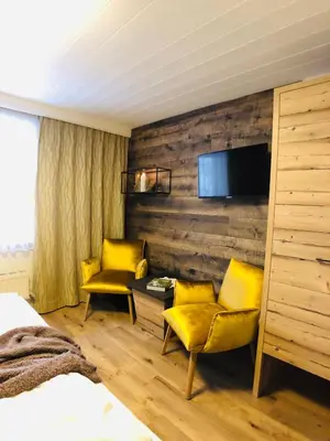 Ein Bett oder Betten in einem Zimmer der Unterkunft Hotel Alpenblick