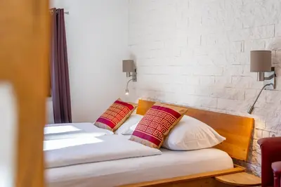 Ein Bett oder Betten in einem Zimmer der Unterkunft Apartments Garden House
