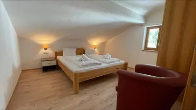 Ein Bett oder Betten in einem Zimmer der Unterkunft Apartments Garden House
