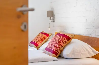 Ein Bett oder Betten in einem Zimmer der Unterkunft Apartments Garden House