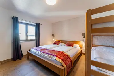 Ein Bett oder Betten in einem Zimmer der Unterkunft Apartments Garden House