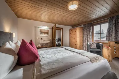 Ein Bett oder Betten in einem Zimmer der Unterkunft Zillertaler Hofchalets Schustererhof