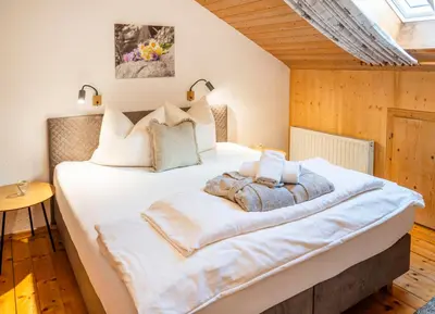 Ein Bett oder Betten in einem Zimmer der Unterkunft Zillertaler Hofchalets Schustererhof