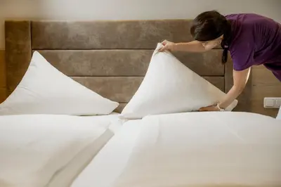 Ein Bett oder Betten in einem Zimmer der Unterkunft ARBOR Hotel & Apartments