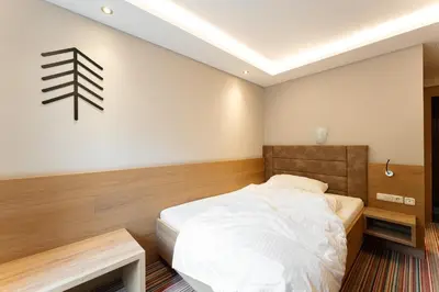 Ein Bett oder Betten in einem Zimmer der Unterkunft ARBOR Hotel & Apartments