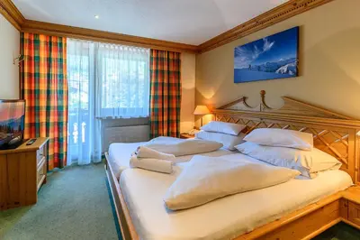 Ein Bett oder Betten in einem Zimmer der Unterkunft SCOL Sporthotel Zillertal
