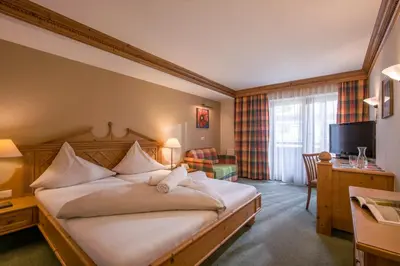 Ein Bett oder Betten in einem Zimmer der Unterkunft SCOL Sporthotel Zillertal