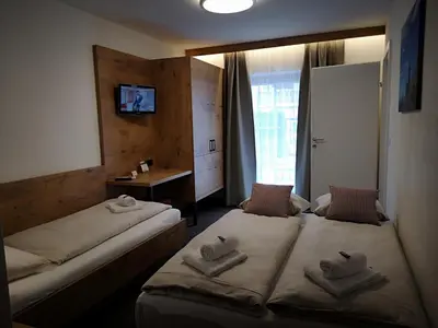 Ein Bett oder Betten in einem Zimmer der Unterkunft Hotel Aschauer Hof z'Fritzn