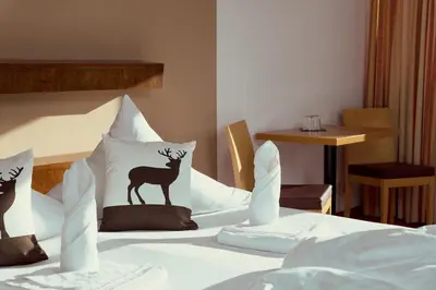 Ein Bett oder Betten in einem Zimmer der Unterkunft Parkhotel Kirchberg