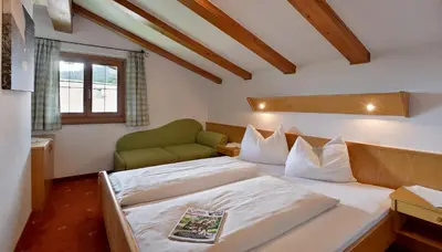 Ein Bett oder Betten in einem Zimmer der Unterkunft Appartements am Römerweg