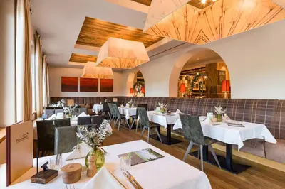 Ein Restaurant oder anderes Speiselokal in der Unterkunft Appartements am Römerweg
