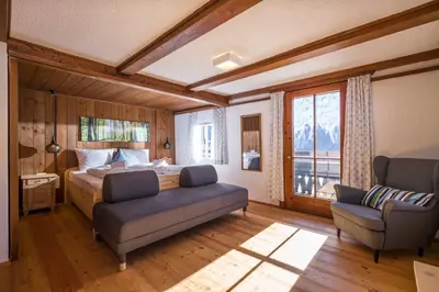 Ein Bett oder Betten in einem Zimmer der Unterkunft Berg'k'hof Kaisertal - Alpine Hideaway